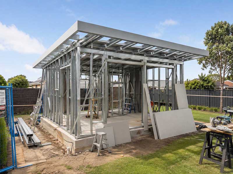 Light-gauge steel frame erected ready for cladding — build sequence reference